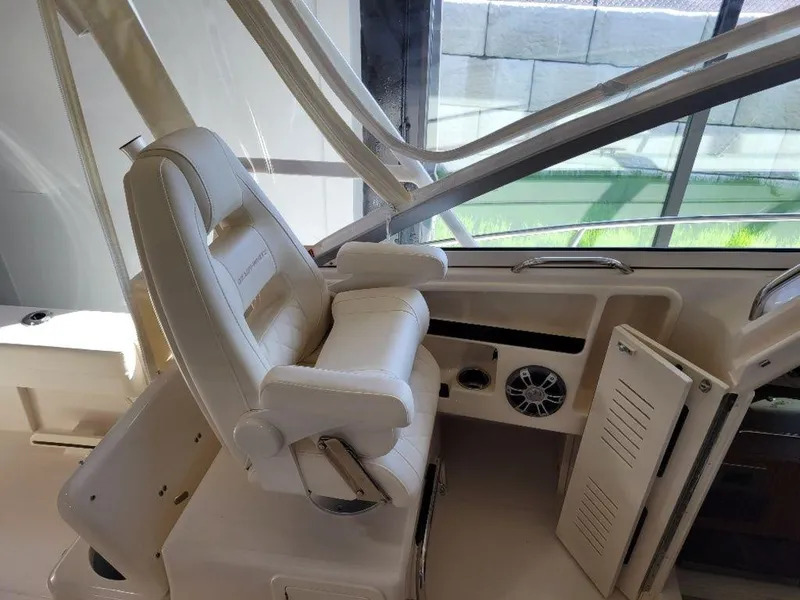 Slide: The Image of 2024 Grady-White Marlin 300 helm seat and console area. - 10