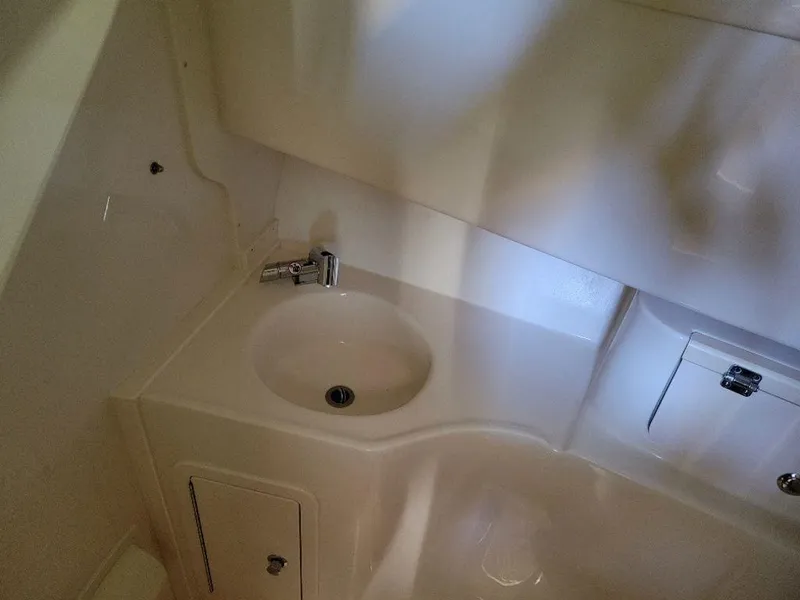 Slide: The Image of 2024 Grady-White Marlin 300 boat interior sink and countertop area. - 19