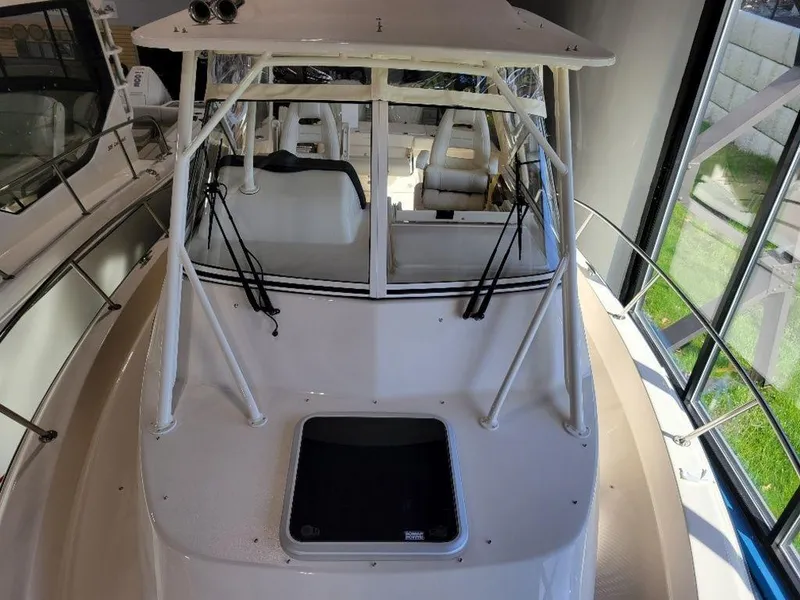 Slide: The Image of 2024 Grady-White Marlin 300 boat interior, helm station view. - 21