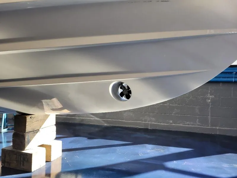 Slide: The Image of 2024 Grady-White Marlin 300 boat hull on blocks in a showroom. - 27