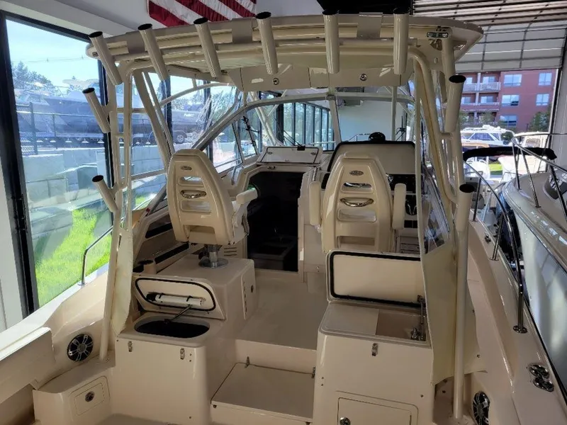 Slide: The Image of 2024 Grady-White Marlin 300 boat interior with seating and helm station. - 3