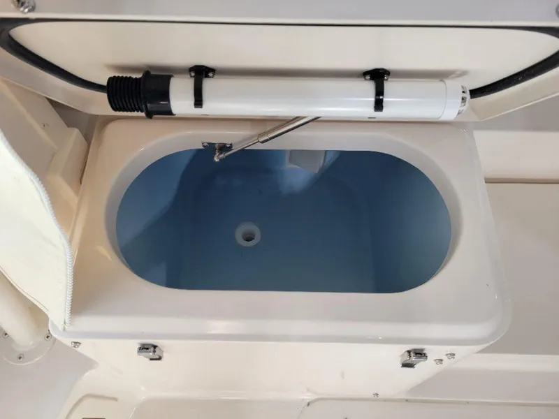 Slide: The Image of 2024 Grady-White Marlin 300 livewell compartment with lid open. - 7