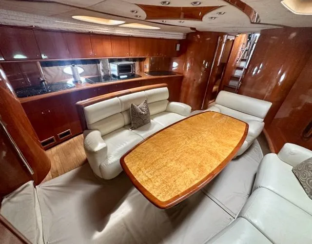 Slide: The Image of Luxurious interior of 2002 Sunseeker 75 Predator yacht with elegant dining area and modern kitchen. - 14