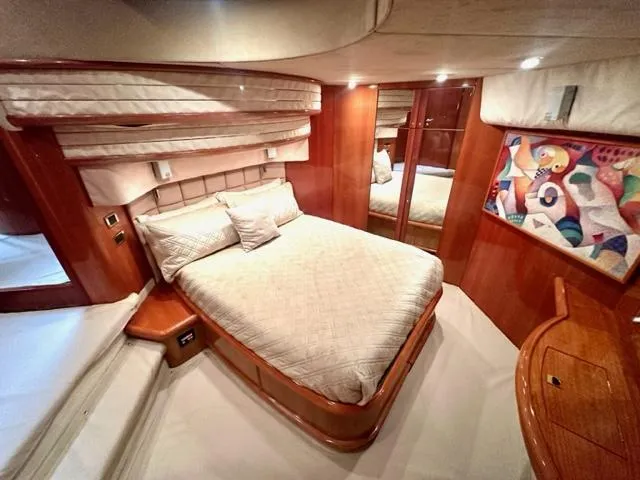 Slide: The Image of Luxurious bedroom interior of 2002 Sunseeker 75 Predator yacht with bed and modern decor. - 15