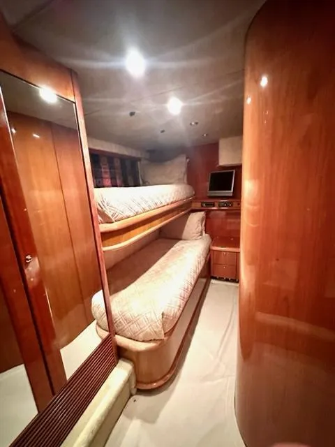 Slide: The Image of Interior cabin of 2002 Sunseeker 75 Predator yacht with bunk beds and wooden finish. - 18