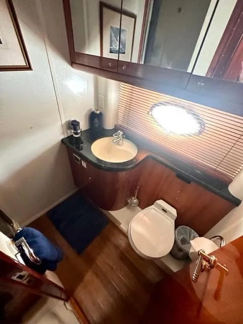 Slide: The Image of Luxurious bathroom in a 2002 Sunseeker 75 Predator yacht with modern amenities. - 19