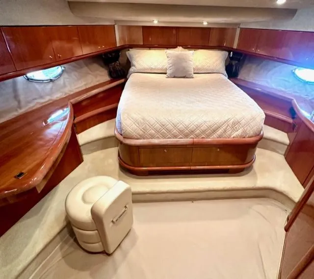 Slide: The Image of Luxurious master cabin in a 2002 Sunseeker 75 Predator yacht with elegant wood finishes. - 20