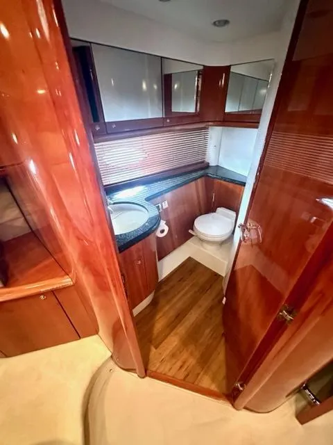 Slide: The Image of Luxurious bathroom in a 2002 Sunseeker 75 Predator yacht with wooden finishes. - 22