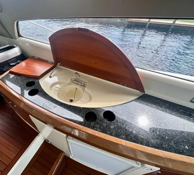 Slide: The Image of Interior sink and countertop of 2002 Sunseeker 75 Predator yacht with water view. - 23