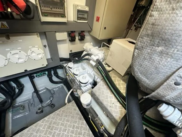 Slide: The Image of Engine room of a 2002 Sunseeker 75 Predator yacht with various mechanical components. - 27