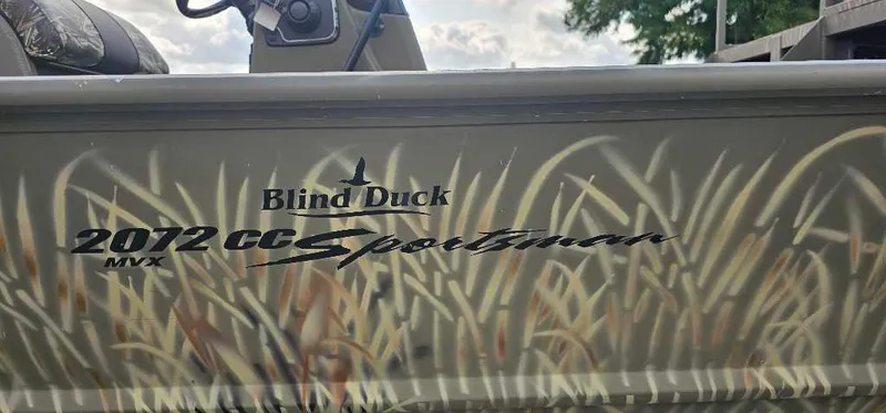 Slide: The Image of 2024 Tracker Grizzly 2072 CC Sportsman boat with Blind Duck camo design. - 2