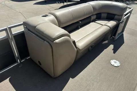 Slide: The Image of 2024 Sun Tracker Party Barge 24 DLX with beige seating on deck. - 7