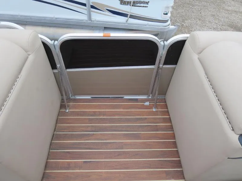 Slide: The Image of Interior view of a 2015 Berkshire 230CL STS pontoon boat with wood flooring. - 7