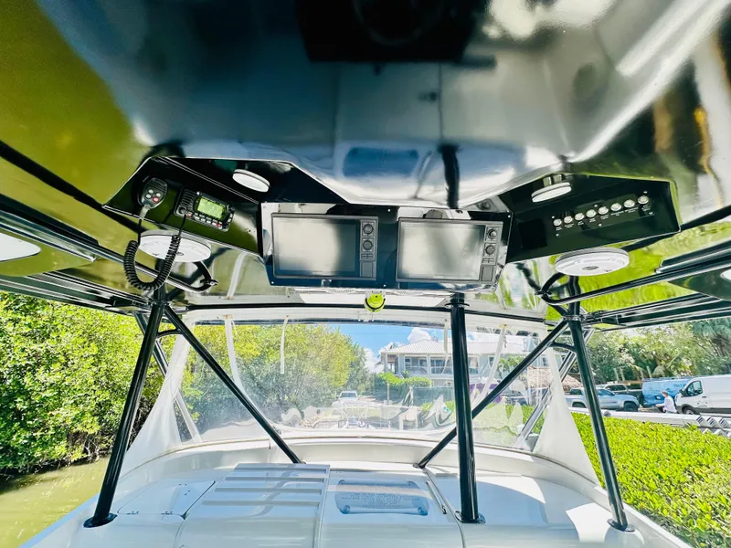 Slide: The Image of 2000 Luhrs Tournament 320 Open boat cockpit with navigation equipment. - 10