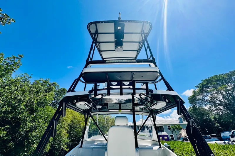 Slide: The Image of 2000 Luhrs Tournament 320 Open boat with tower under clear blue sky. - 14