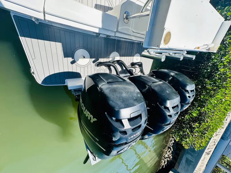 Slide: The Image of 2000 Luhrs Tournament 320 Open with triple Mercury outboard engines. - 19