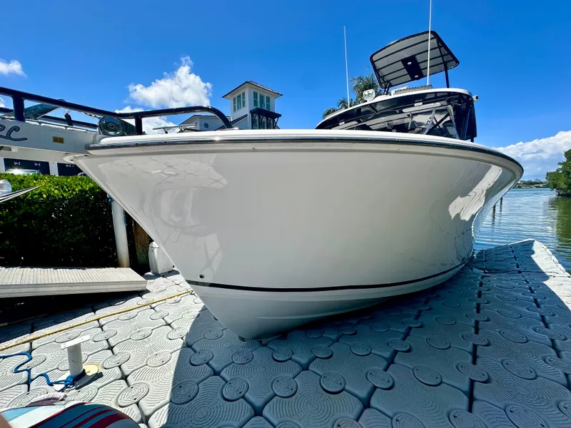 Slide: The Image of 2000 Luhrs Tournament 320 Open boat docked on a sunny day. - 2