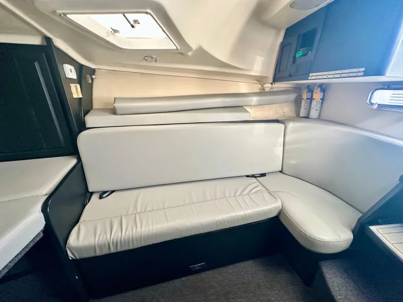 Slide: The Image of Interior of 2000 Luhrs Tournament 320 Open with white cushioned seating. - 26