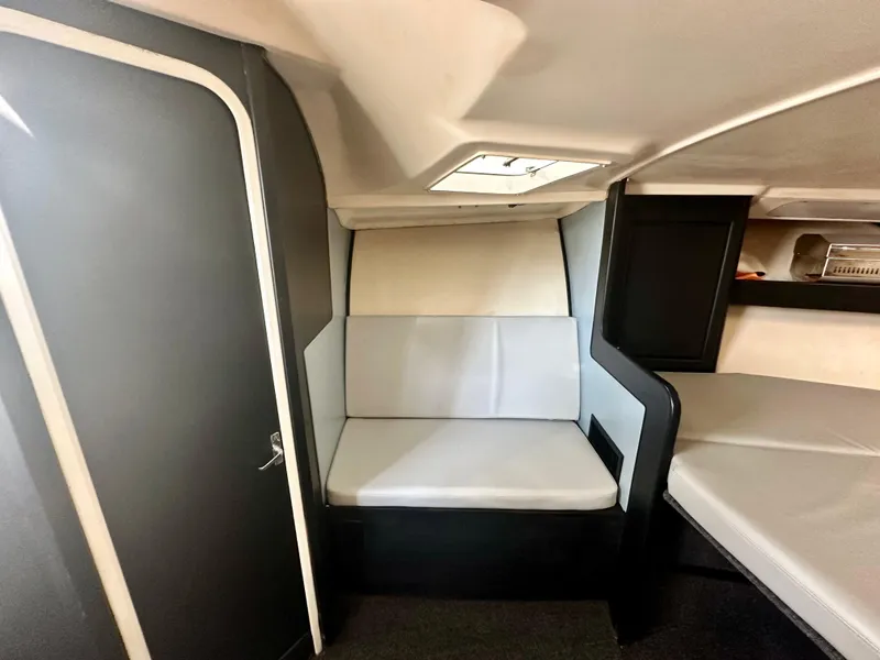 Slide: The Image of Interior cabin of 2000 Luhrs Tournament 320 Open boat with seating and storage. - 27