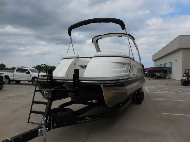 Slide: The Image of 2019 Bennington QX 25 QXFBA pontoon boat on trailer in parking lot. - 7