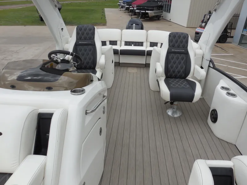 Slide: The Image of 2019 Bennington QX 25 QXFBA pontoon boat interior with luxurious seating. - 9