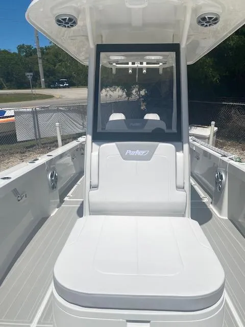 Slide: The Image of 2024 Parker 2900 CC boat interior with seating and console. - 2