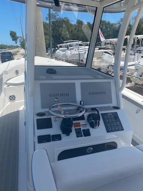 Slide: The Image of 2024 Parker 2900 CC boat dashboard with Garmin navigation systems. - 5
