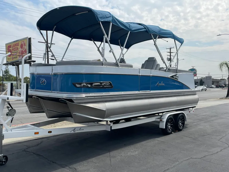 The Image of 2025 Avalon 2385 Catalina QLS pontoon boat displayed at Johnson Marine showroom. - 0