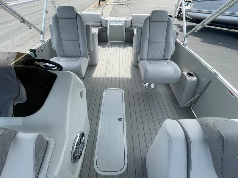Slide: The Image of 2025 Avalon 2385 Catalina QLS pontoon boat with blue exterior and spacious deck. - 3