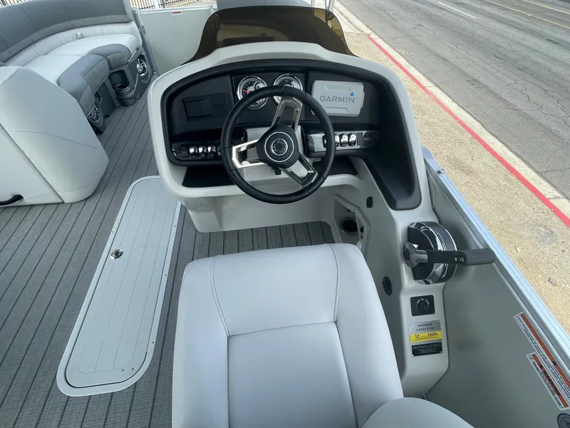 Slide: The Image of 2025 Avalon 2385 Catalina QLS boat helm with modern steering and controls. - 5