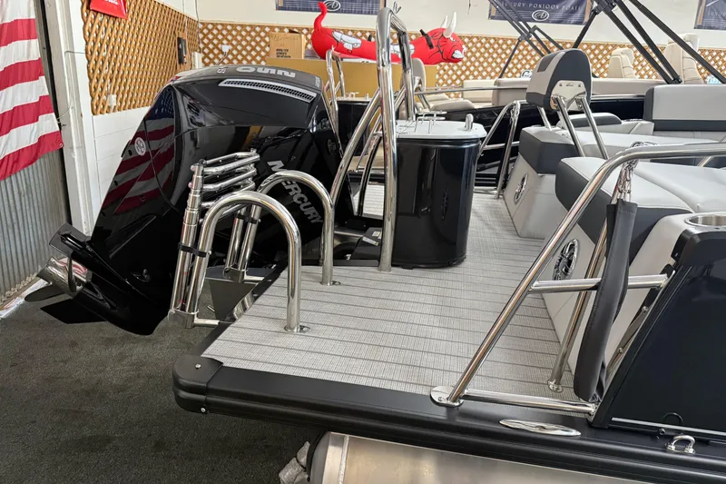 Slide: The Image of 2025 Avalon 2385 Catalina QLS boat with Mercury engine, sleek design, and modern seating. - 9