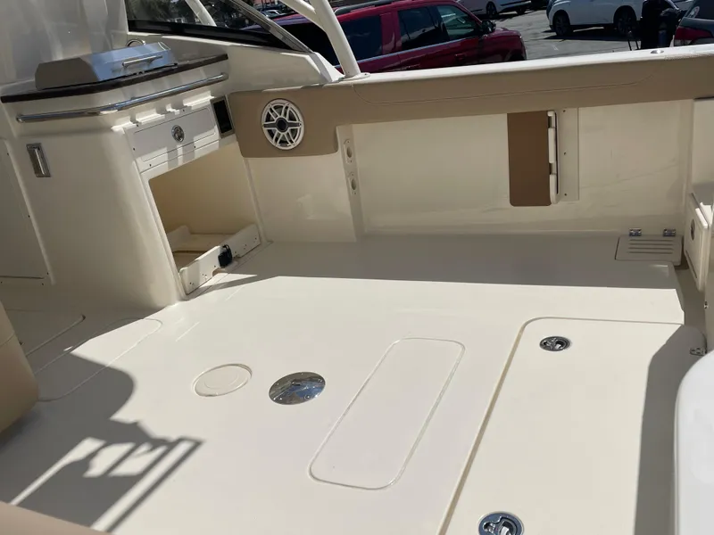 Slide: The Image of 2024 Scout 255 Dorado boat interior with spacious deck and storage compartments. - 3