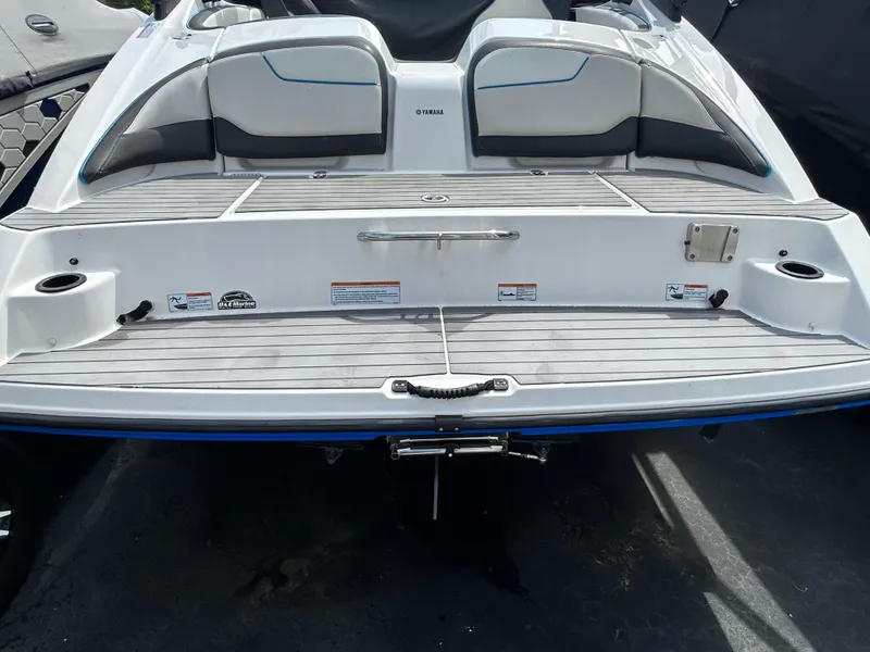 Slide: The Image of 2019 Yamaha Boats AR 210 rear deck with seating and swim platform. - 11