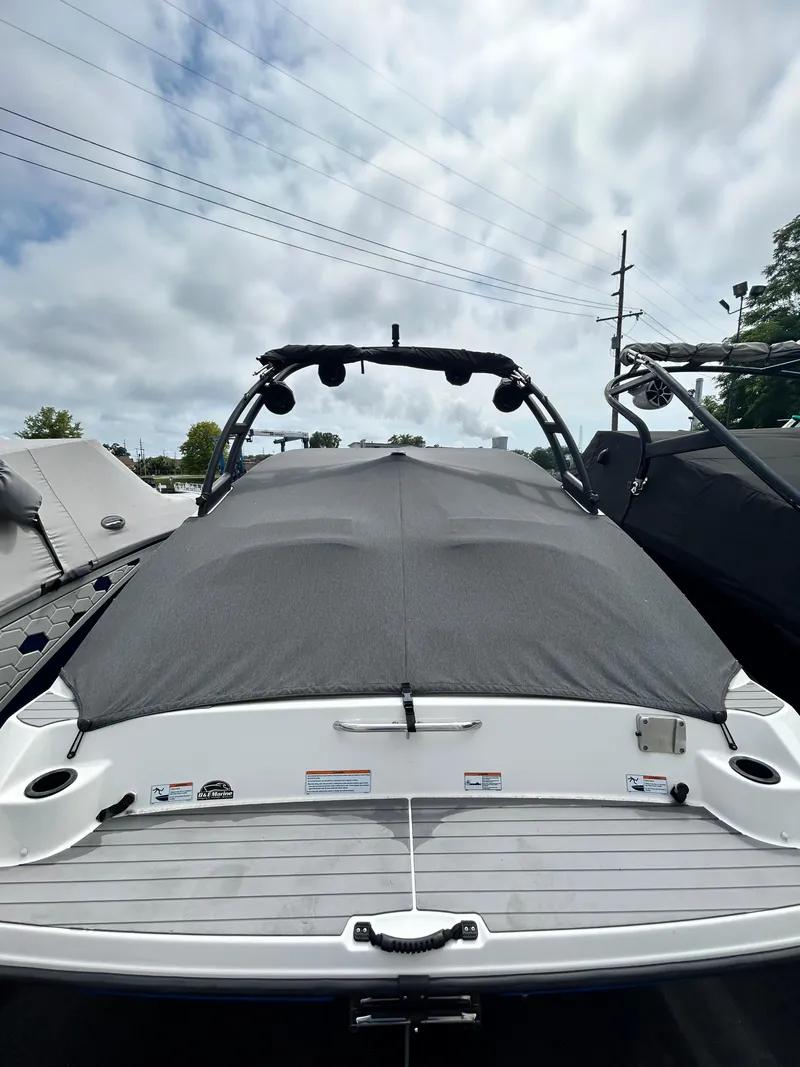 Slide: The Image of 2019 Yamaha Boats AR 210 with cover, rear view. - 4