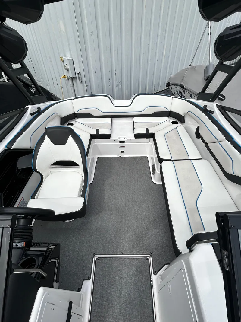 Slide: The Image of 2019 Yamaha Boats AR 210 interior with white and black seating. - 6