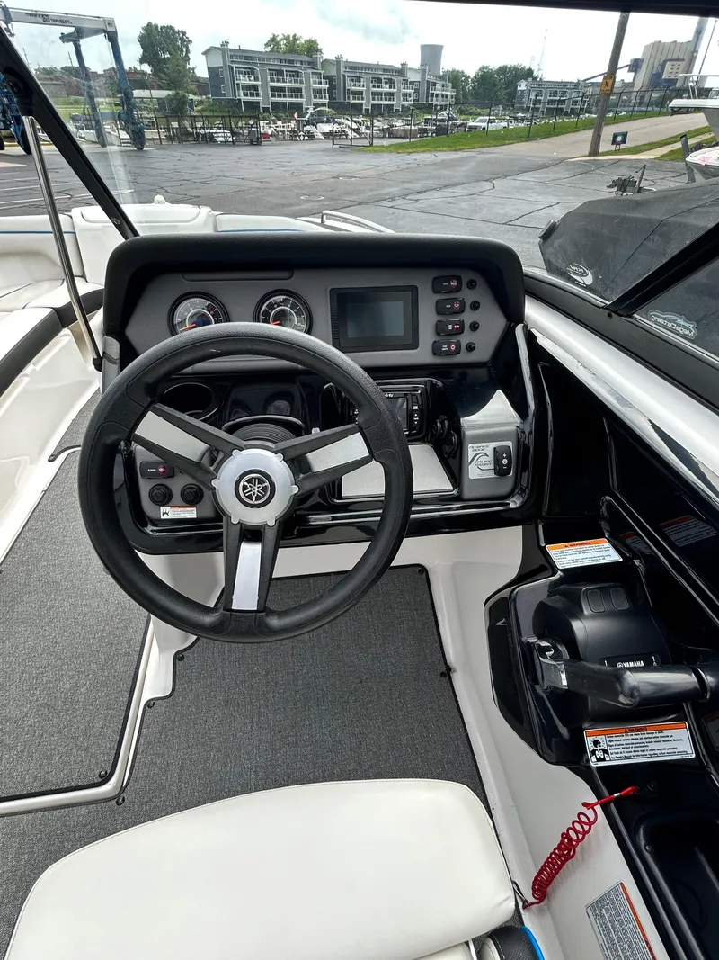 Slide: The Image of 2019 Yamaha Boats AR 210 dashboard and steering wheel. - 8