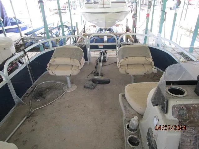 Slide: The Image of 2022 Sun Tracker Bass Buggy pontoon boat interior with fishing seats and equipment. - 6