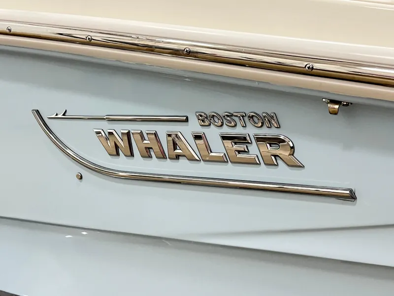 Slide: The Image of 2024 Boston Whaler 130 SPT boat logo on hull. - 7
