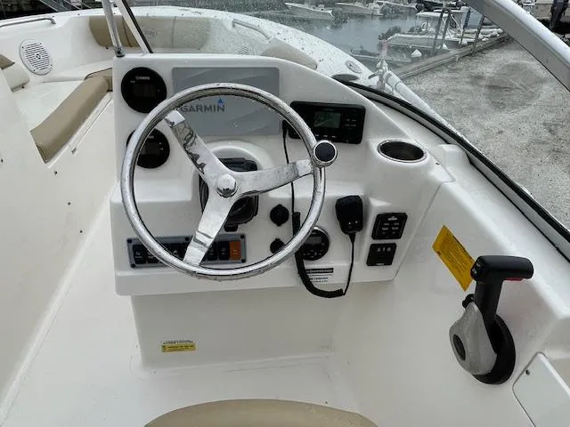 Slide: The Image of 2019 Key West 203 DFS boat dashboard with Garmin navigation system and steering wheel. - 7