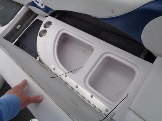 Slide: The Image of 2005 Nautique Air 226 boat storage compartments and cup holders. - 13