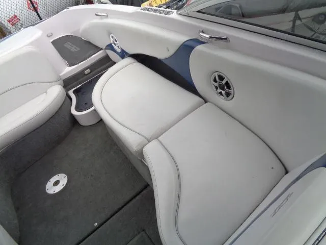 Slide: The Image of 2005 Nautique Air 226 boat interior with white and blue seating. - 14
