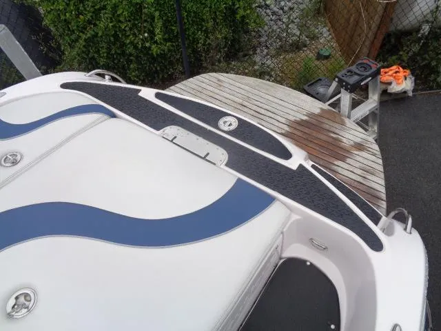 Slide: The Image of 2005 Nautique Air 226 boat stern with swim platform and seating area. - 2