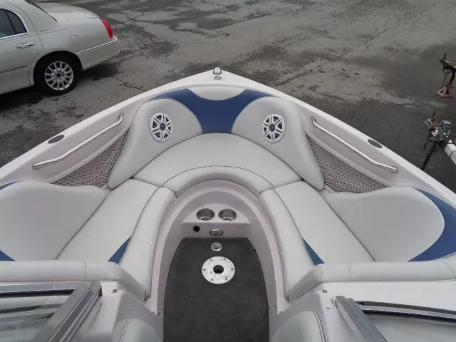 Slide: The Image of 2005 Nautique Air 226 boat interior with white and blue seating. - 23