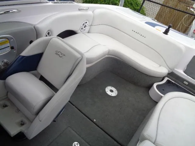 Slide: The Image of 2005 Nautique Air 226 boat interior with white and gray seating. - 25