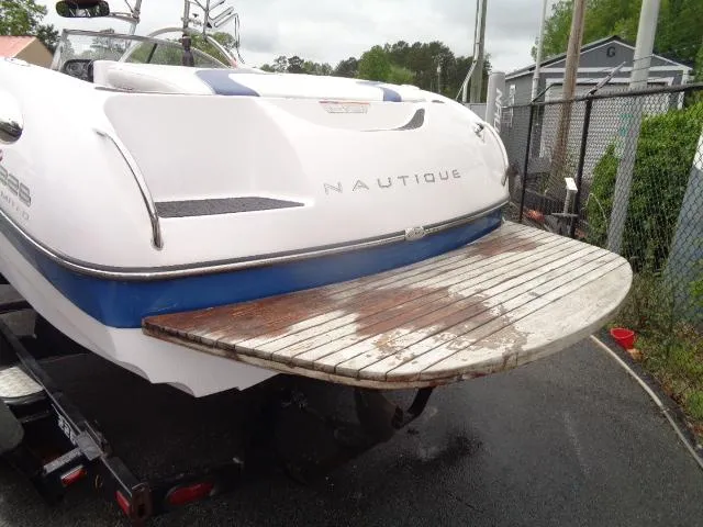 Slide: The Image of 2005 Nautique Air 226 boat with wooden swim platform. - 5