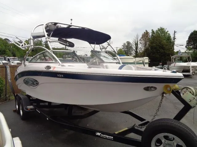 Slide: The Image of 2005 Nautique Air 226 boat on trailer with canopy. - 8