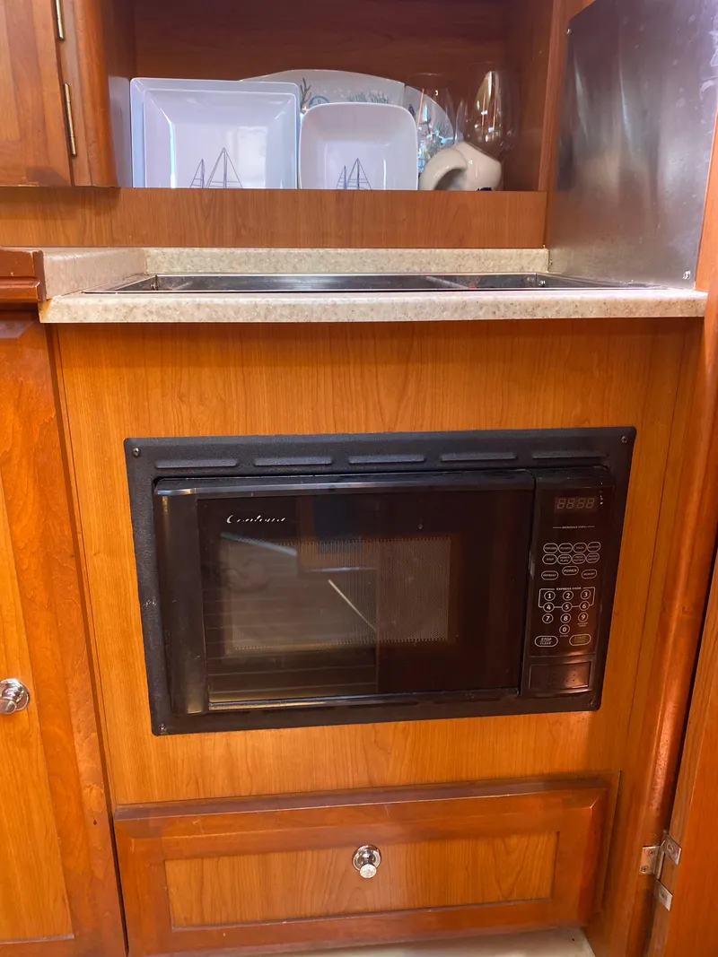 Slide: The Image of Built-in microwave in a 2009 Hunter 31-2 sailboat galley. - 12