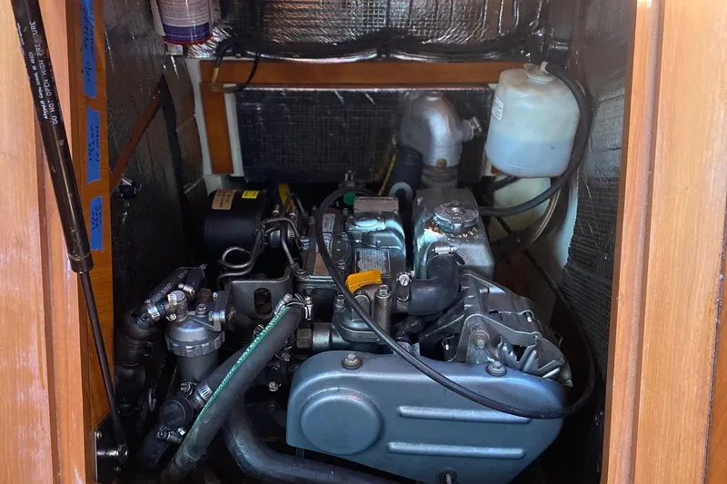 Slide: The Image of 2009 Hunter 31-2 engine compartment with visible components and wiring. - 21