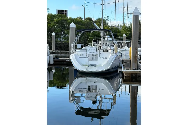 Slide: The Image of Hunter 31-2 sailboat docked, reflecting on calm water, 2009 model. - 22