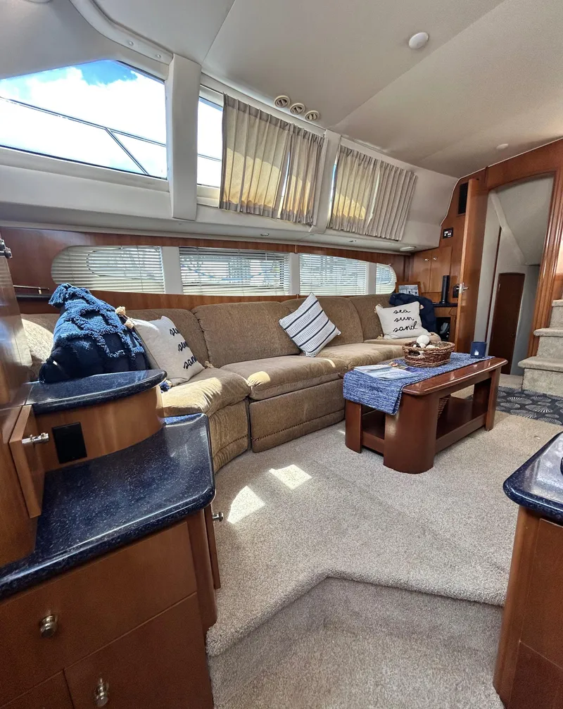Slide: The Image of Interior of 2002 Carver 444 Cockpit Motor Yacht with cozy seating area. - 20